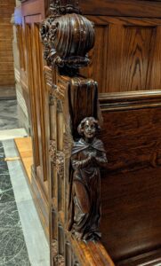 An angel carved into the pew
